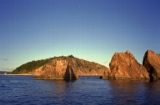 Rocks and the shadow of our sailboat