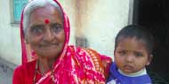 [Image of a lady and child in India]